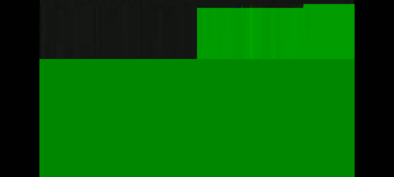 The image shows a mostly green screen with a smaller black section at the left.