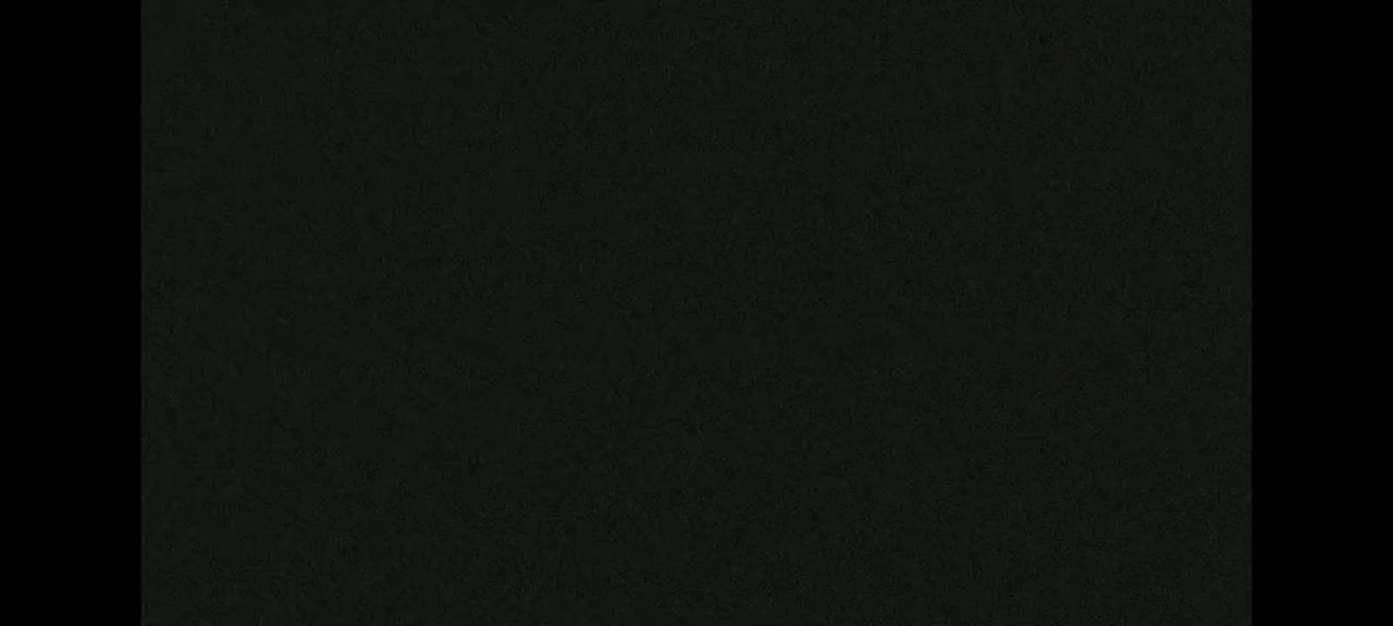 The image shows a dark, textured surface.