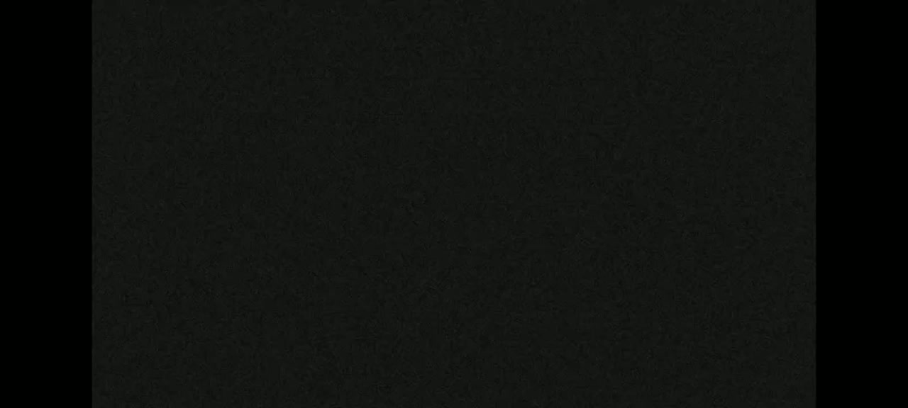 The image shows a dark-gray textured surface.