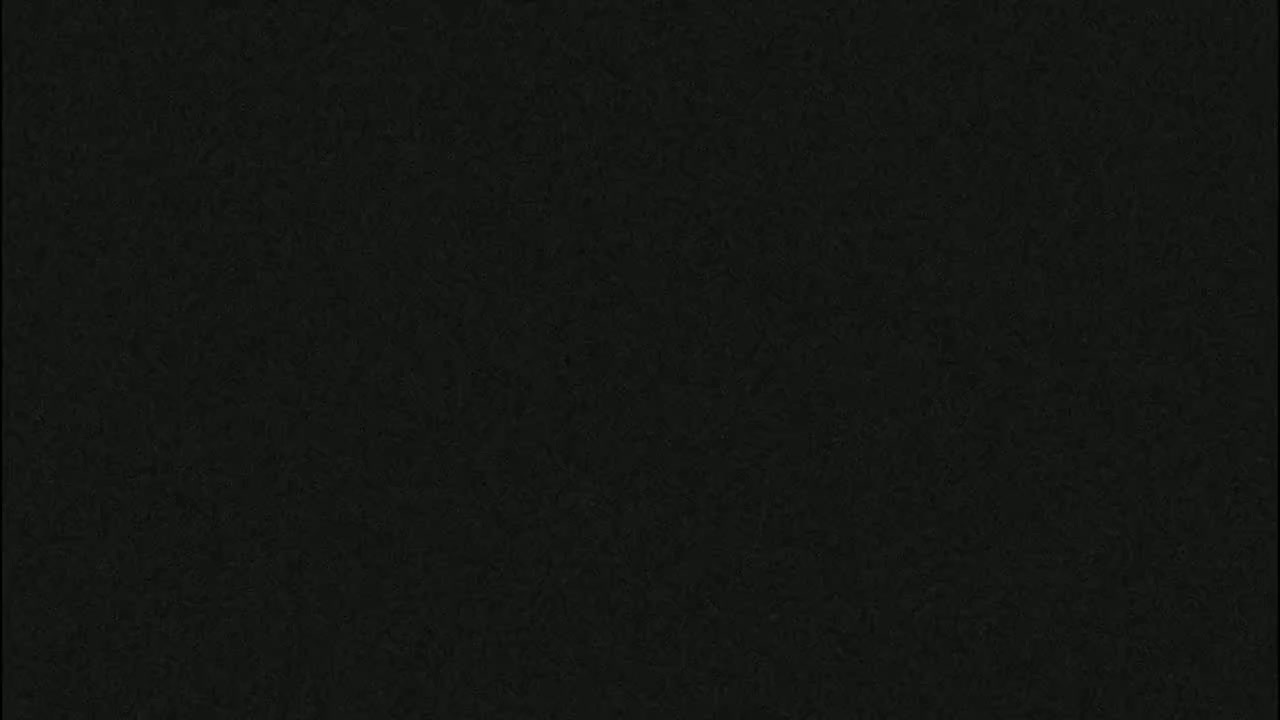The image shows a dark-gray textured surface.
