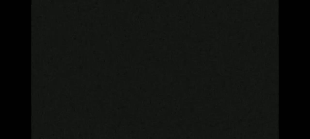 The image shows a uniformly dark gray or black textured surface.
