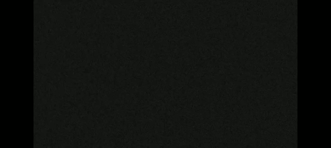 The image shows a dark, textured surface.