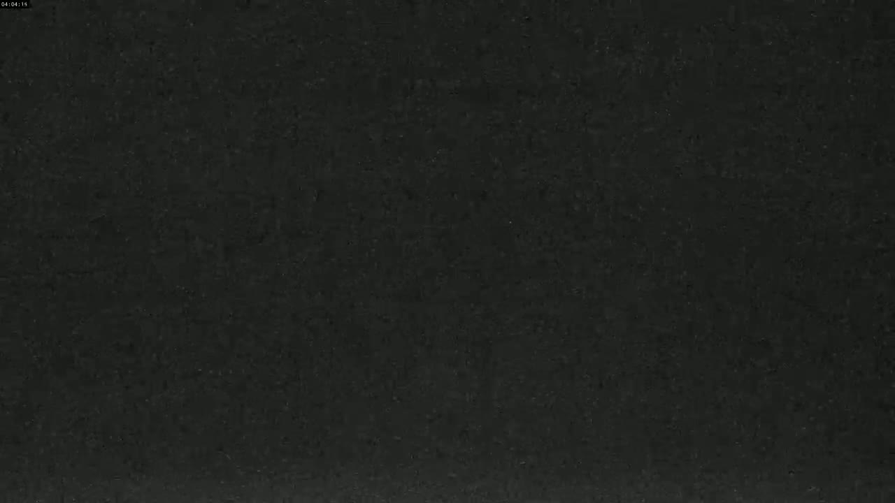 The image shows a dark gray or black textured surface.