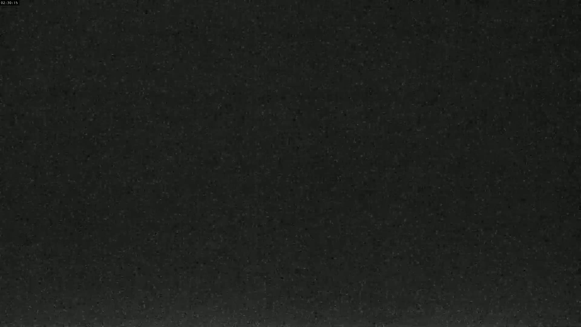The image shows a dark gray or black textured surface.