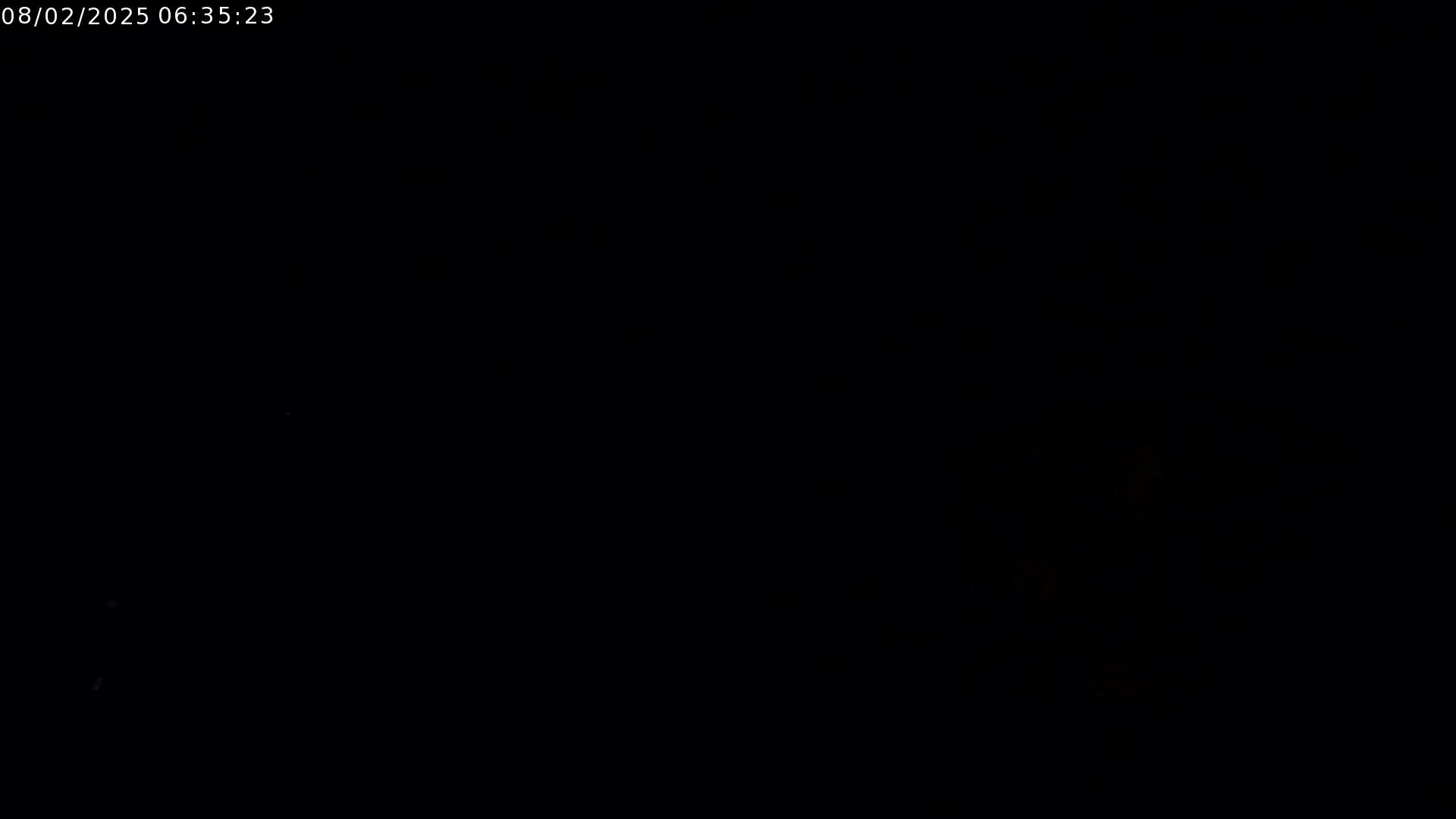 The image shows a completely dark scene, possibly at night.