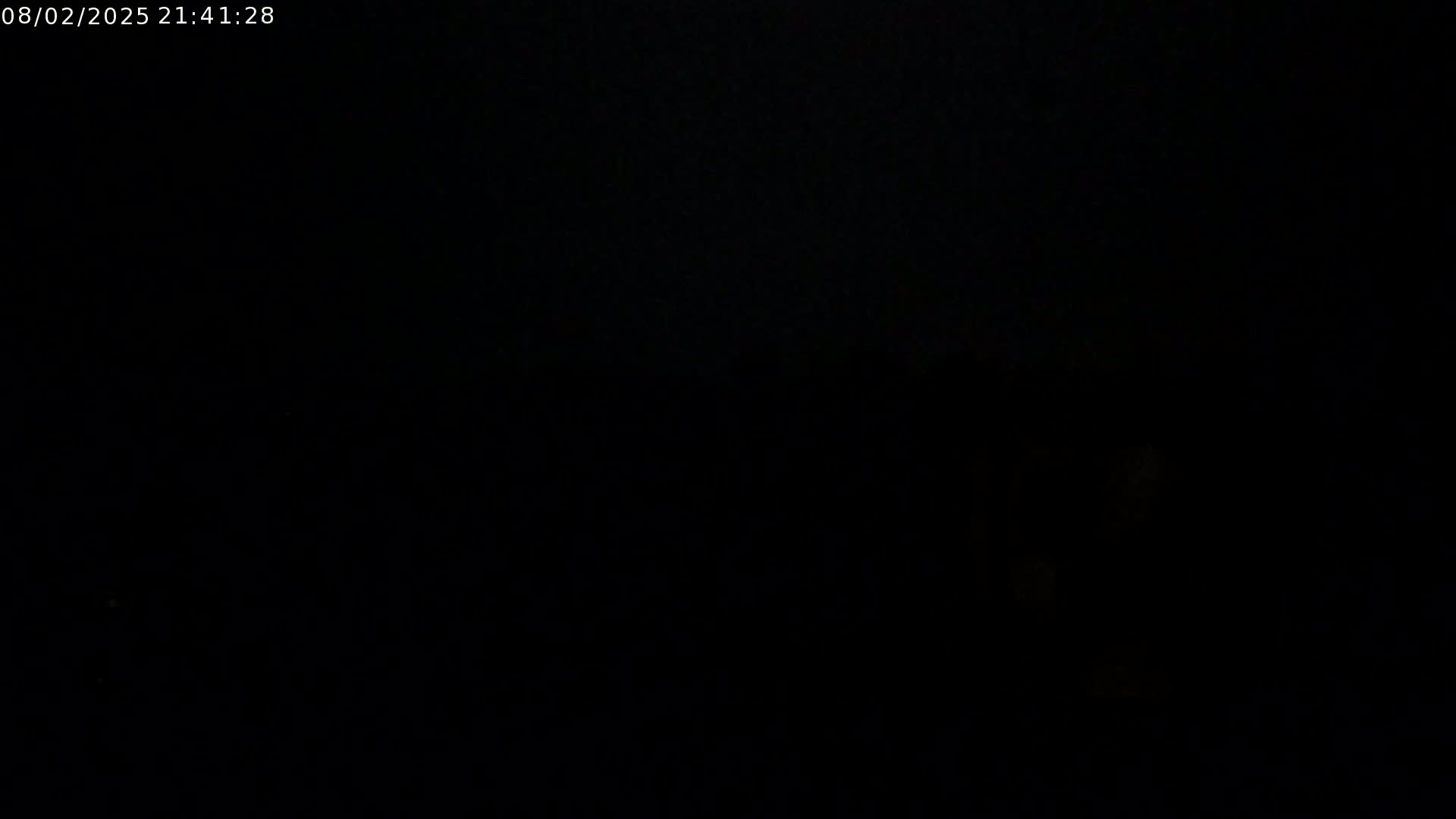 The image is entirely black, suggesting nighttime conditions.