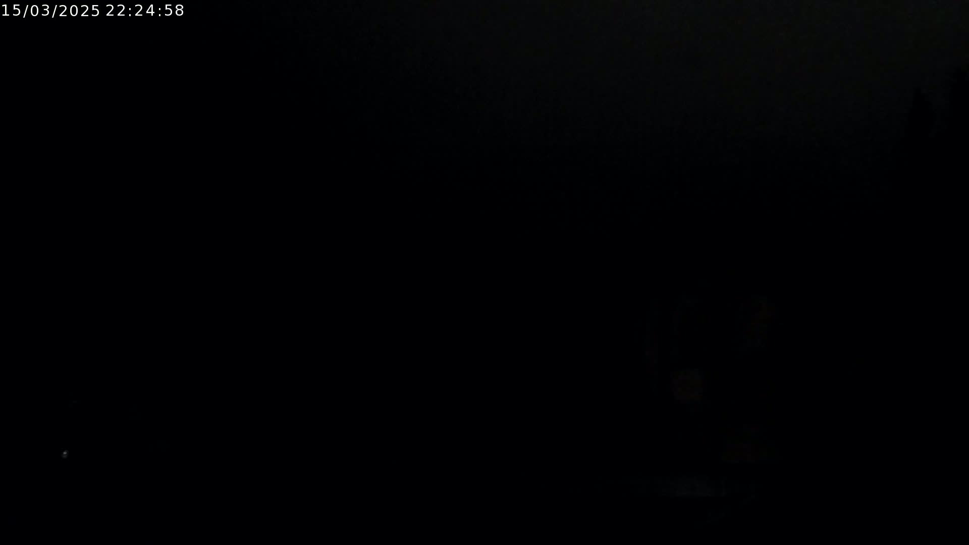 The image is completely black, possibly depicting nighttime conditions.