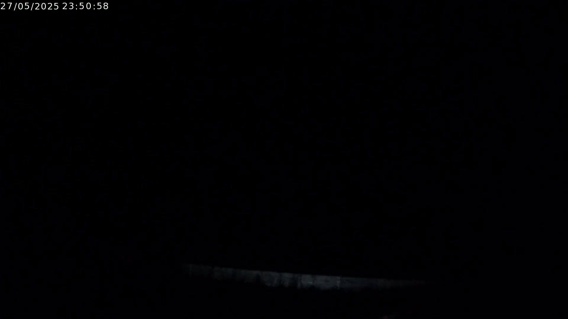 A very dark image shows a faint, horizontal light gray line near the bottom.