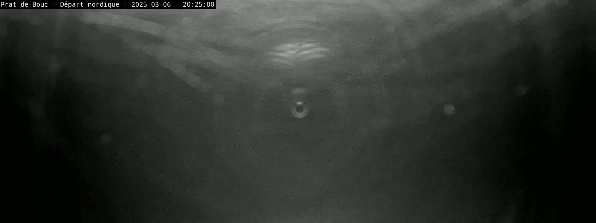 A blurry, dark gray image shows an indistinct object in the center, possibly underwater or in heavy fog.