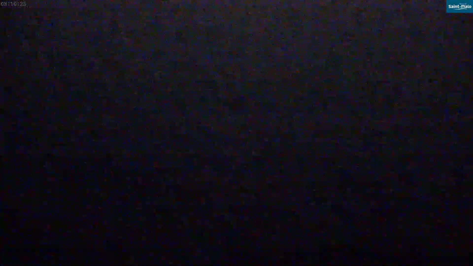 The image shows a dark, grainy screen, possibly indicating a nighttime or low-light video feed.