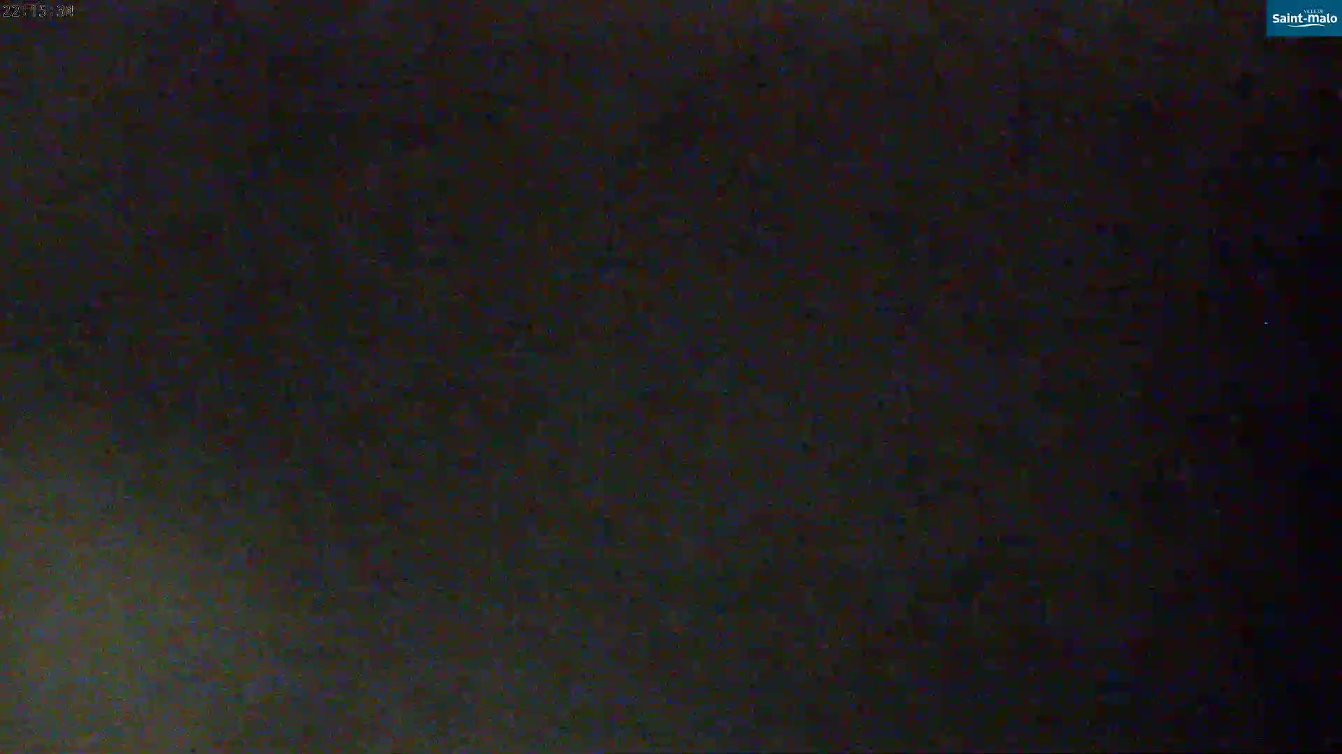The image shows a dark, blurry, and mostly featureless scene at night.
