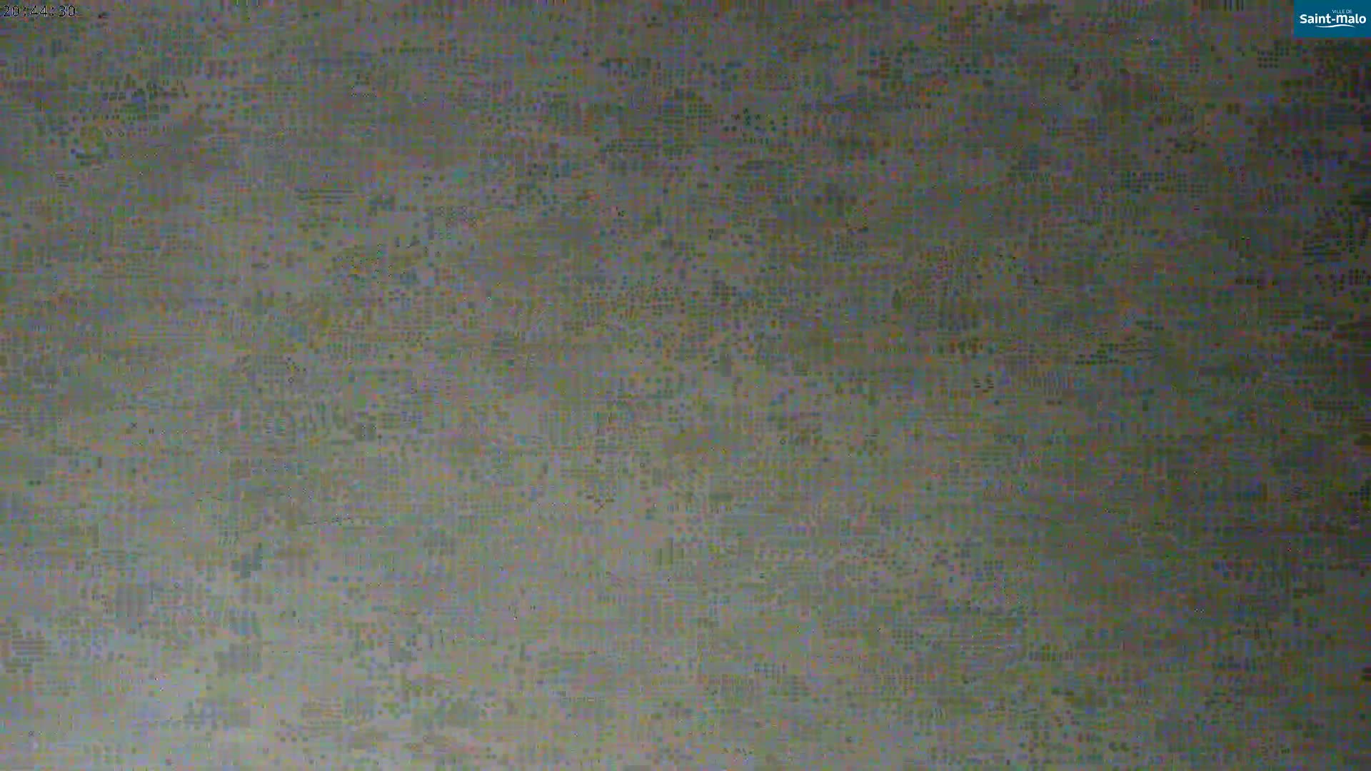 The image shows a heavily pixelated or distorted view of a mottled, textured surface.