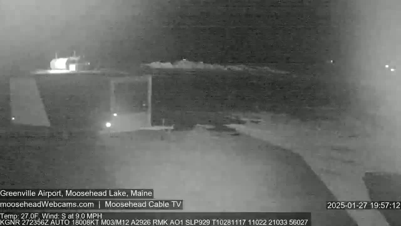 A nighttime, low-visibility view of a building and surrounding area, with a south wind at 9.0 mph.