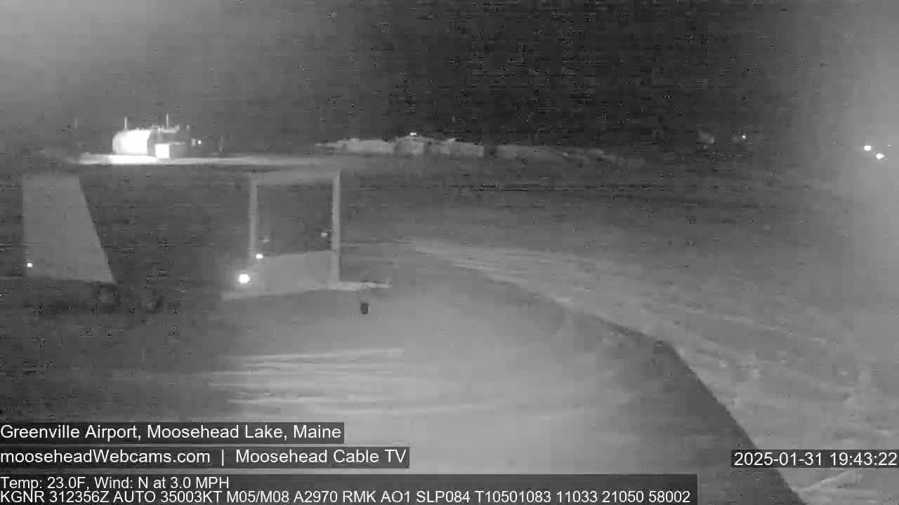 A nighttime, low-light view of an airport with a calm, northerly wind at 3 mph and a temperature of 23 degrees Fahrenheit.
