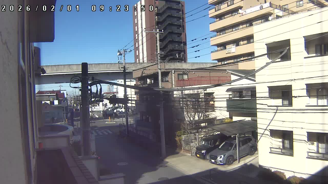 Tokyo, Yazaike, Ogubashi-Dori Avenue / Yazaike 3  Intersection & Nippori Toneri Liner 3. km Viaduct towrads South  ( 東京・谷在家・尾久橋通り / 谷在家3交差点＆日暮里舎人ライナー高架橋 ) Live Cam -  1 Chome, Yazaike, Adachi-ku, Tokyo, Kanto, Honshu, Japan