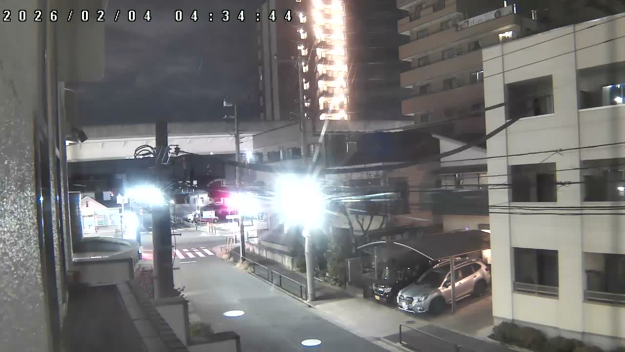 Tokyo, Yazaike, Ogubashi-Dori Avenue / Yazaike 3  Intersection & Nippori Toneri Liner 3. km Viaduct towrads South  ( 東京・谷在家・尾久橋通り / 谷在家3交差点＆日暮里舎人ライナー高架橋 ) Live Cam -  1 Chome, Yazaike, Adachi-ku, Tokyo, Kanto, Honshu, Japan
