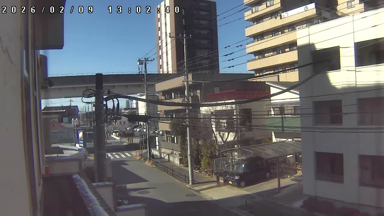 Tokyo, Yazaike, Ogubashi-Dori Avenue / Yazaike 3  Intersection & Nippori Toneri Liner 3. km Viaduct towrads South  ( 東京・谷在家・尾久橋通り / 谷在家3交差点＆日暮里舎人ライナー高架橋 ) Live Cam -  1 Chome, Yazaike, Adachi-ku, Tokyo, Kanto, Honshu, Japan