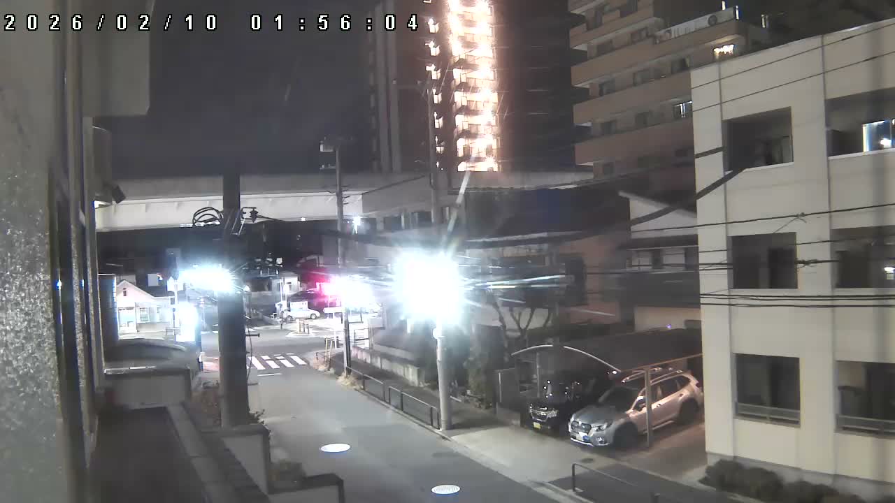 Tokyo, Yazaike, Ogubashi-Dori Avenue / Yazaike 3  Intersection & Nippori Toneri Liner 3. km Viaduct towrads South  ( 東京・谷在家・尾久橋通り / 谷在家3交差点＆日暮里舎人ライナー高架橋 ) Live Cam -  1 Chome, Yazaike, Adachi-ku, Tokyo, Kanto, Honshu, Japan