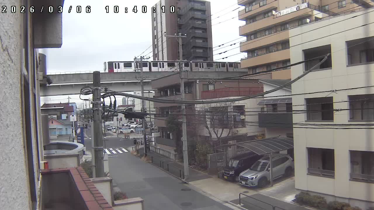 Tokyo, Yazaike, Ogubashi-Dori Avenue / Yazaike 3  Intersection & Nippori Toneri Liner 3. km Viaduct towrads South  ( 東京・谷在家・尾久橋通り / 谷在家3交差点＆日暮里舎人ライナー高架橋 ) Live Cam -  1 Chome, Yazaike, Adachi-ku, Tokyo, Kanto, Honshu, Japan