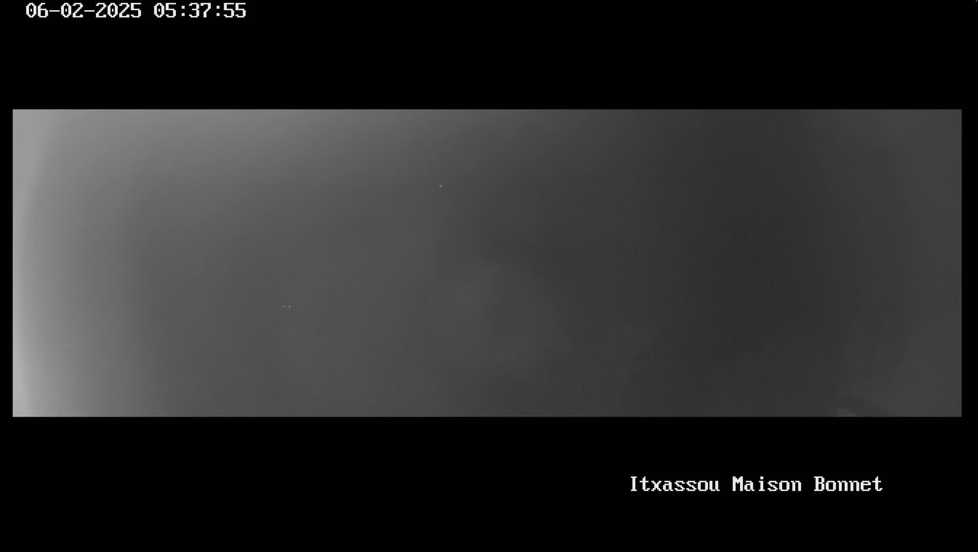 A mostly gray, overcast sky is visible.