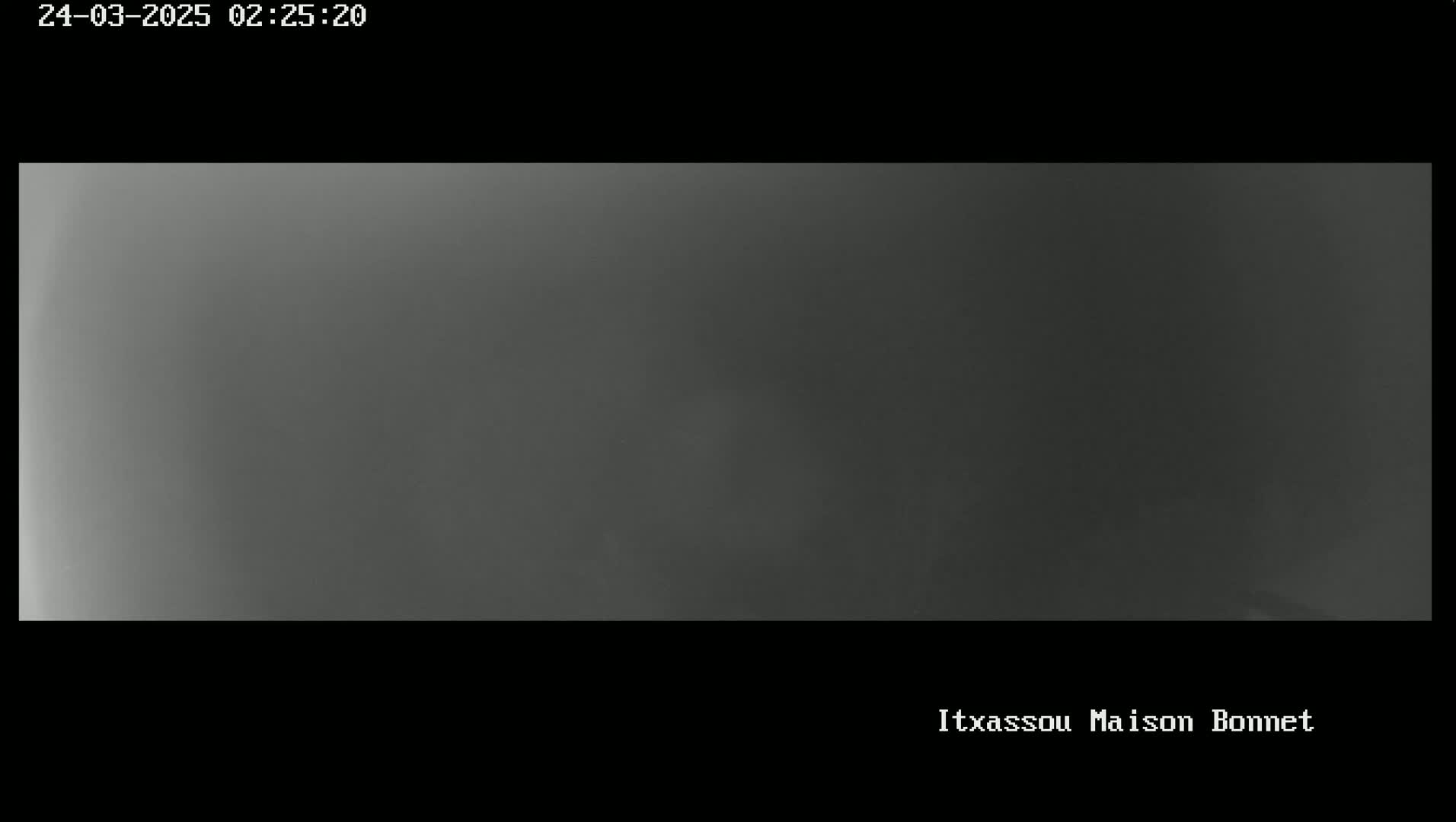 A uniformly dark gray image shows a solid expanse of fog or heavy mist.