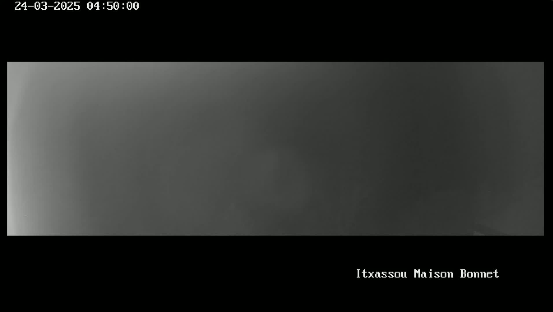 A uniformly dark gray image shows a solid, featureless expanse.
