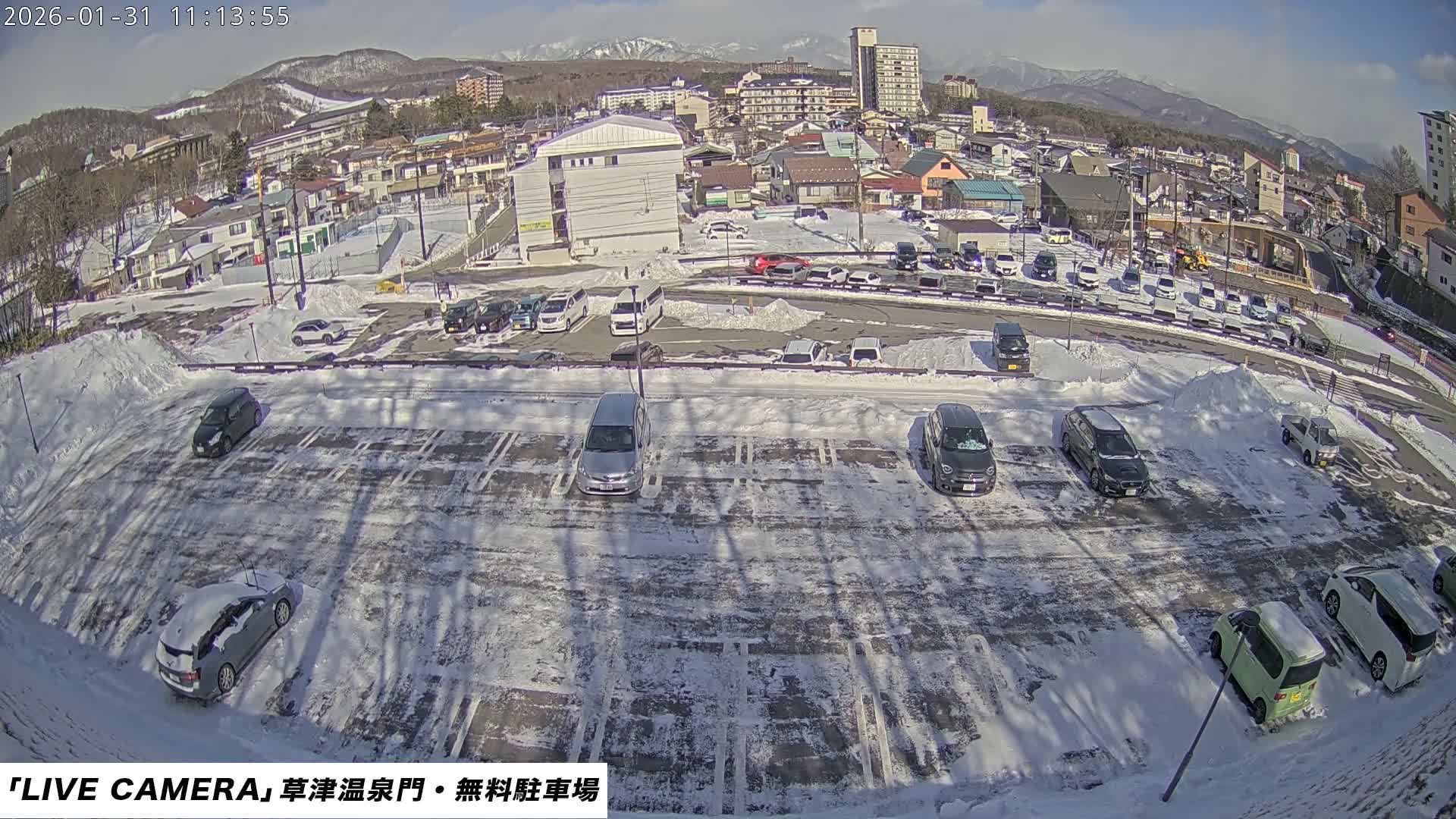 Gunma, Kusatsu Onsen Gate Car Parking Hot Spring Mon Parking Lot & Kusatsu Skyline View towards Northeast ( 群馬県草津温泉門前駐車場と北東方向の草津スカイラインの眺め ) Live Cam  - Kusatsu, Agatsuma-gun , Gunma, Kantō, Honshu, 