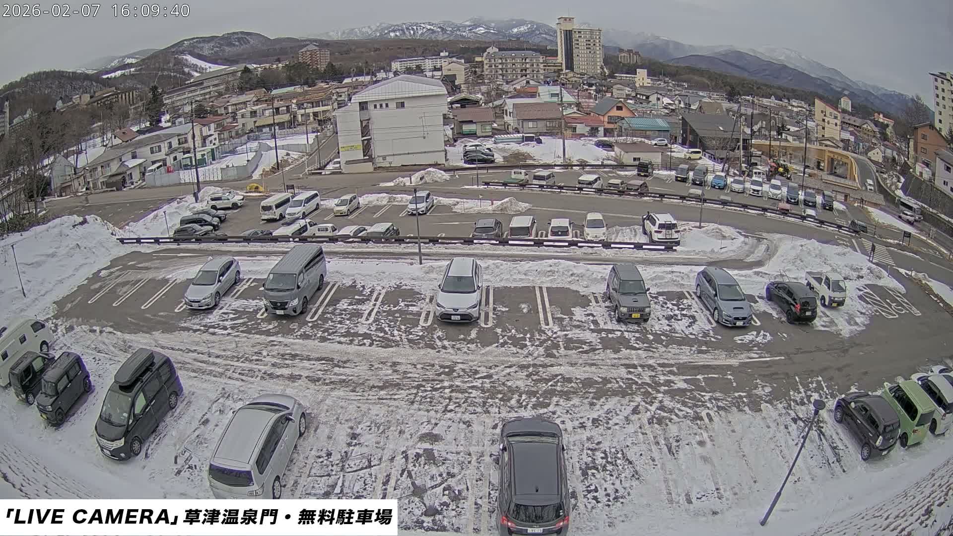 Gunma, Kusatsu Onsen Gate Car Parking Hot Spring Mon Parking Lot & Kusatsu Skyline View towards Northeast ( 群馬県草津温泉門前駐車場と北東方向の草津スカイラインの眺め ) Live Cam  - Kusatsu, Agatsuma-gun , Gunma, Kantō, Honshu, 