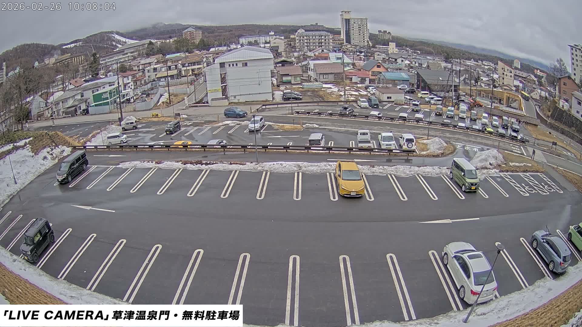 Gunma, Kusatsu Onsen Gate Car Parking Hot Spring Mon Parking Lot & Kusatsu Skyline View towards Northeast ( 群馬県草津温泉門前駐車場と北東方向の草津スカイラインの眺め ) Live Cam  - Kusatsu, Agatsuma-gun , Gunma, Kantō, Honshu, 