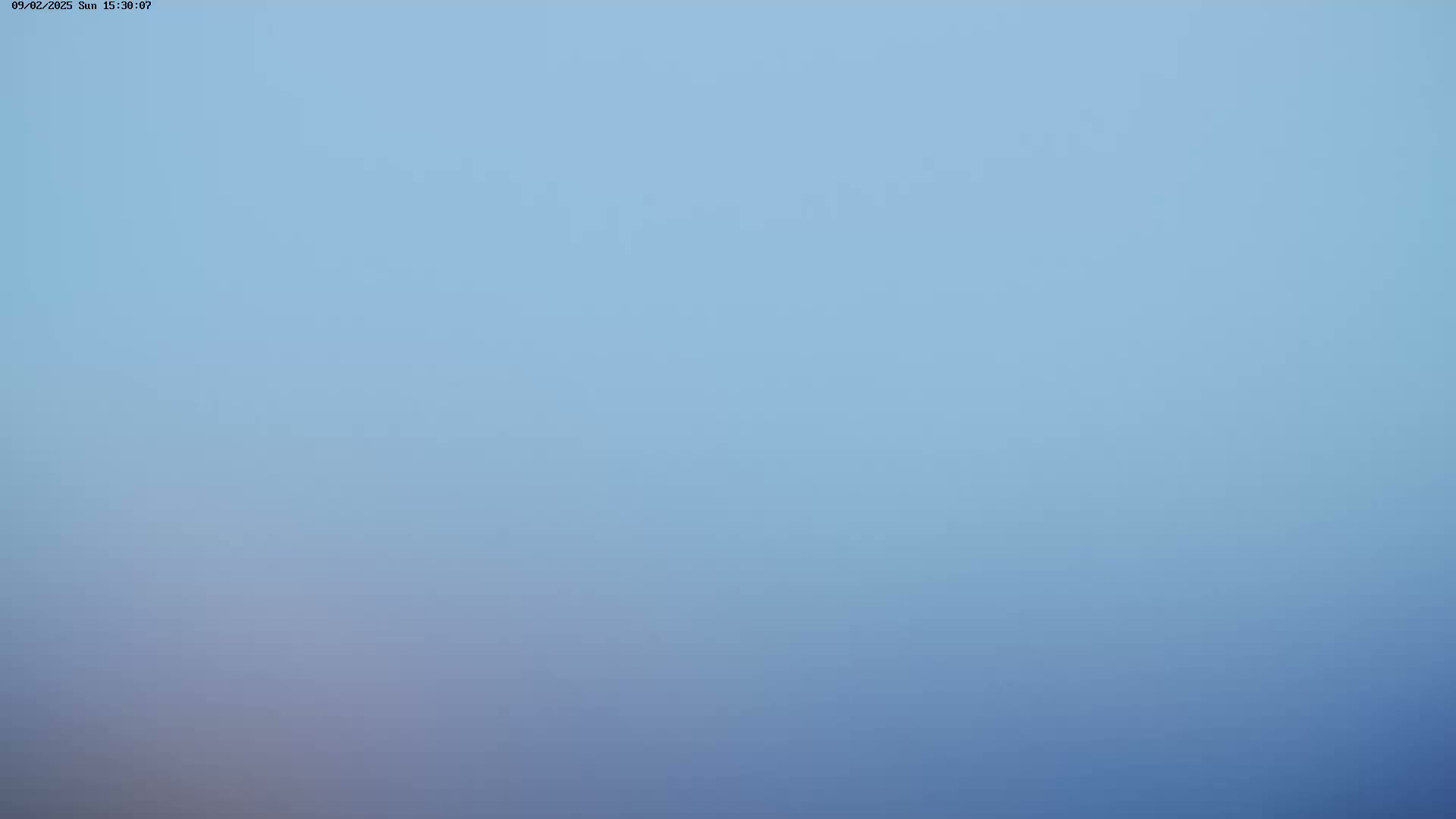 A hazy, light-blue sky is visible.