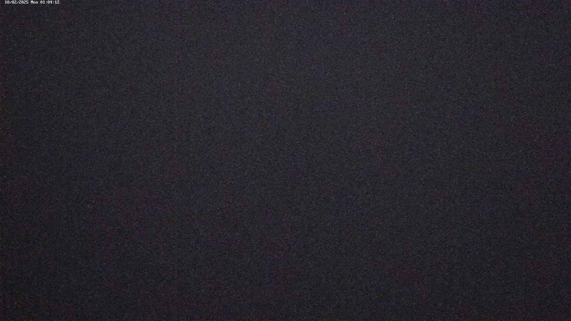 The image shows a dark gray or black textured surface.