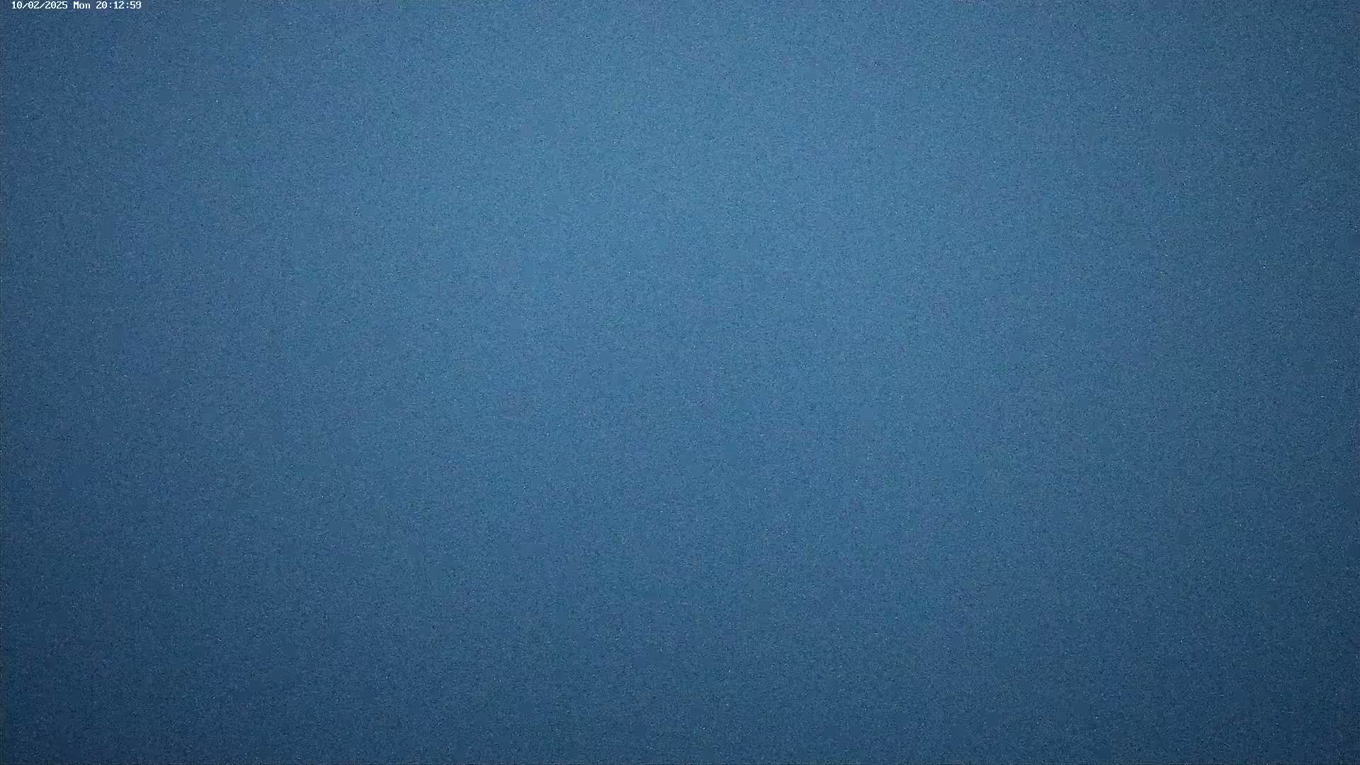 The image shows a solid, textured, dark blue surface.