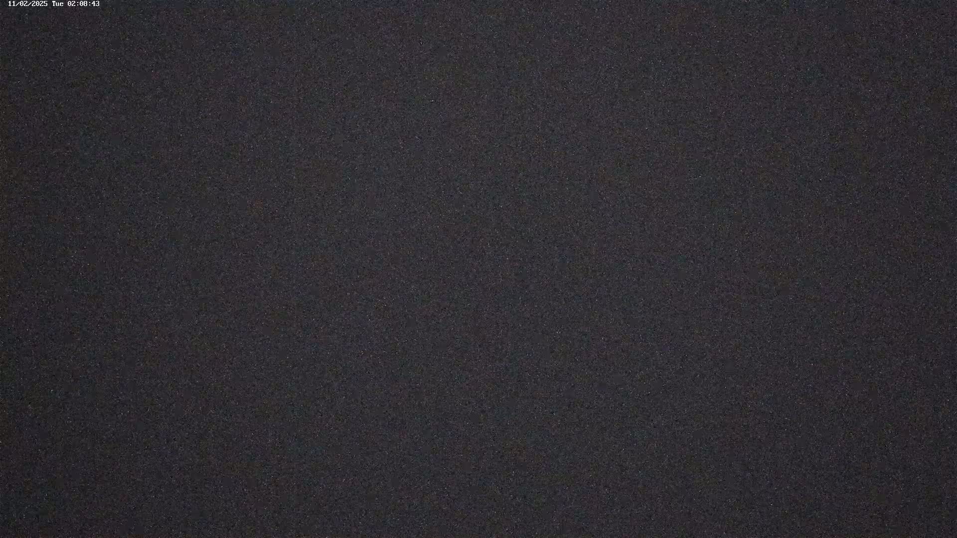 The image shows a dark gray or black textured surface.