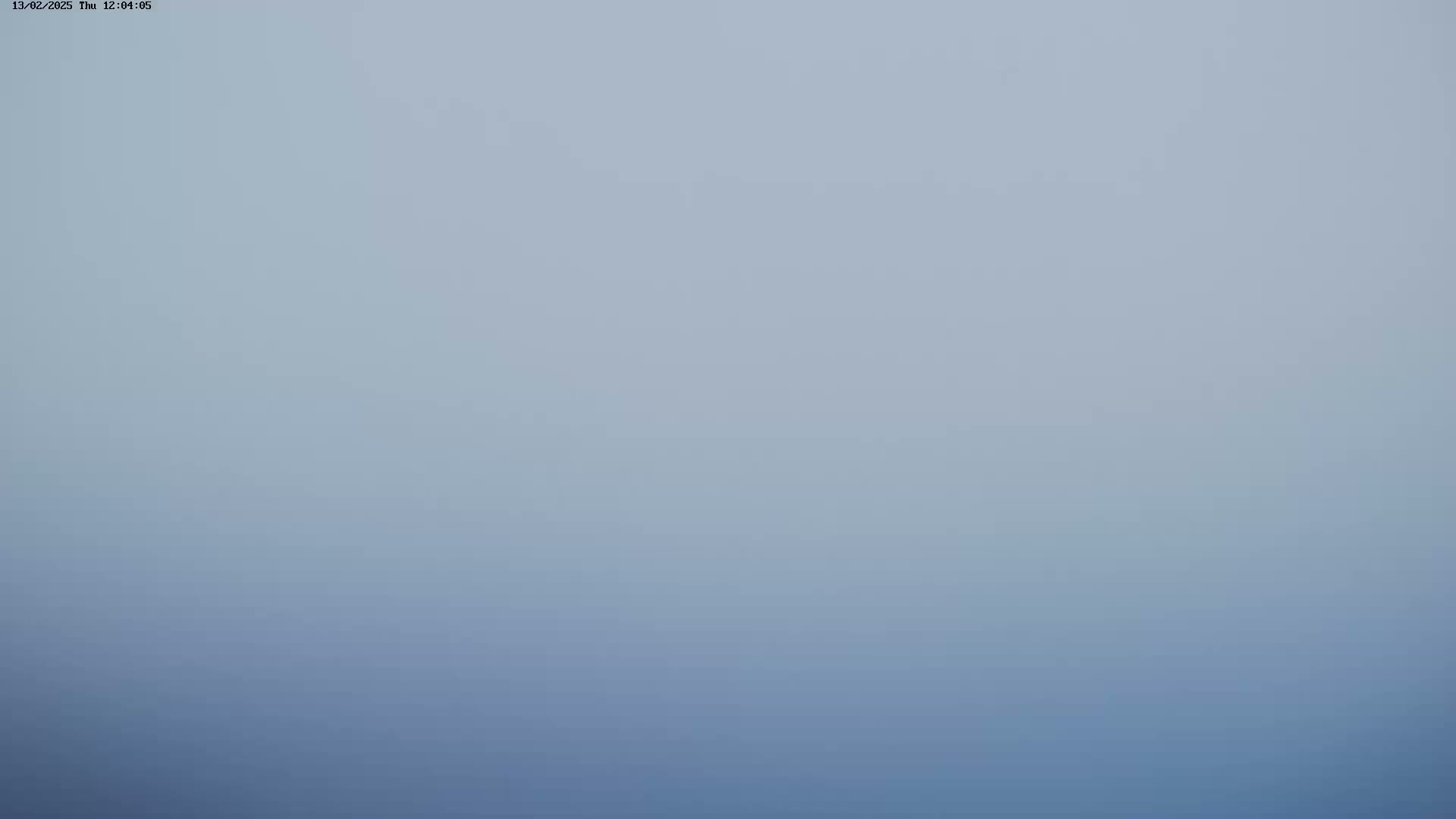 A hazy, light-blue sky is visible.