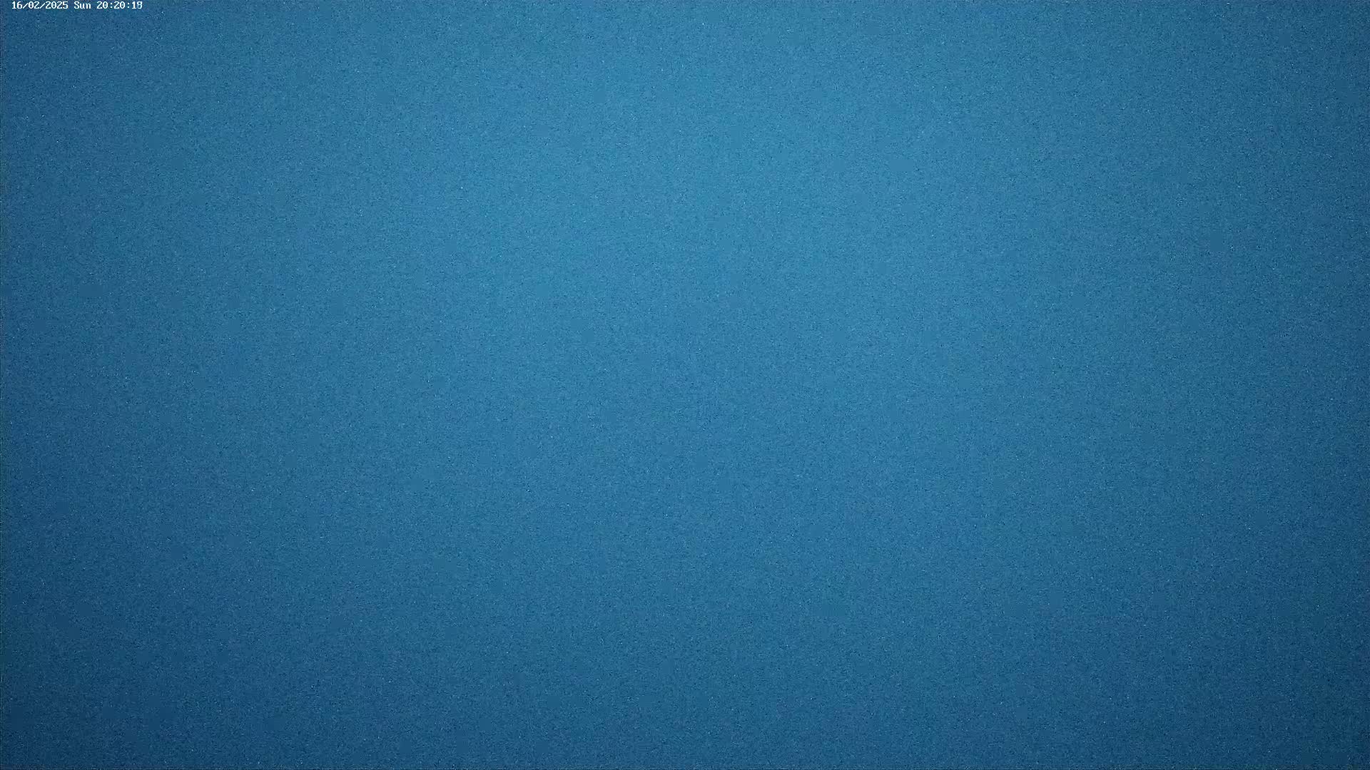 The image shows a solid, textured, dark blue surface.