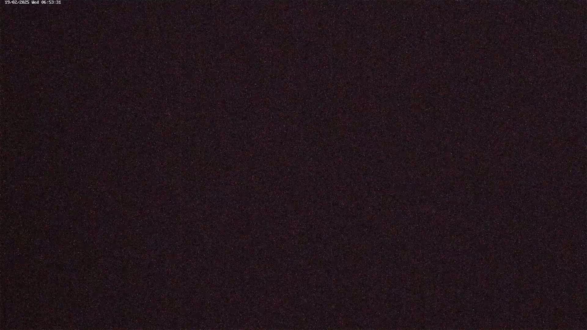 The image shows a dark, grainy, possibly nighttime scene.
