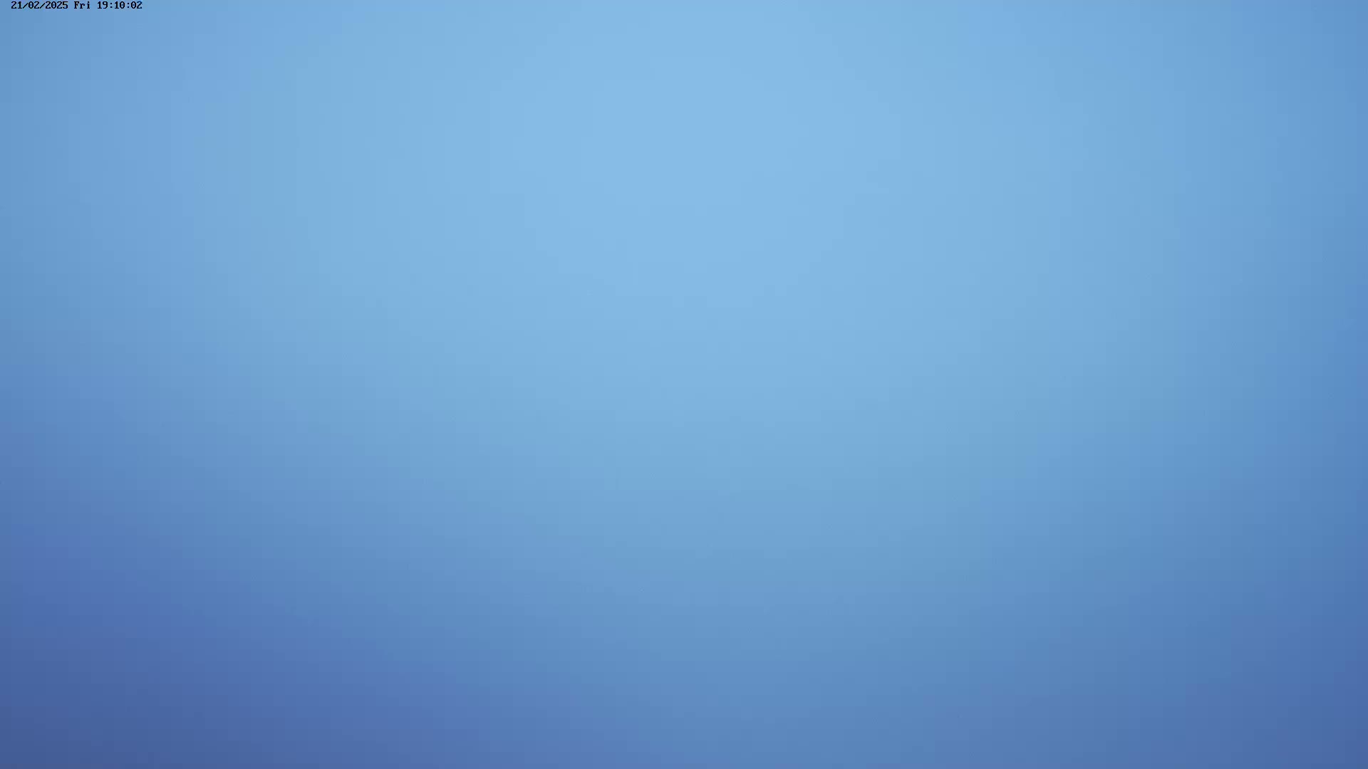 A solid, light-blue sky is shown.