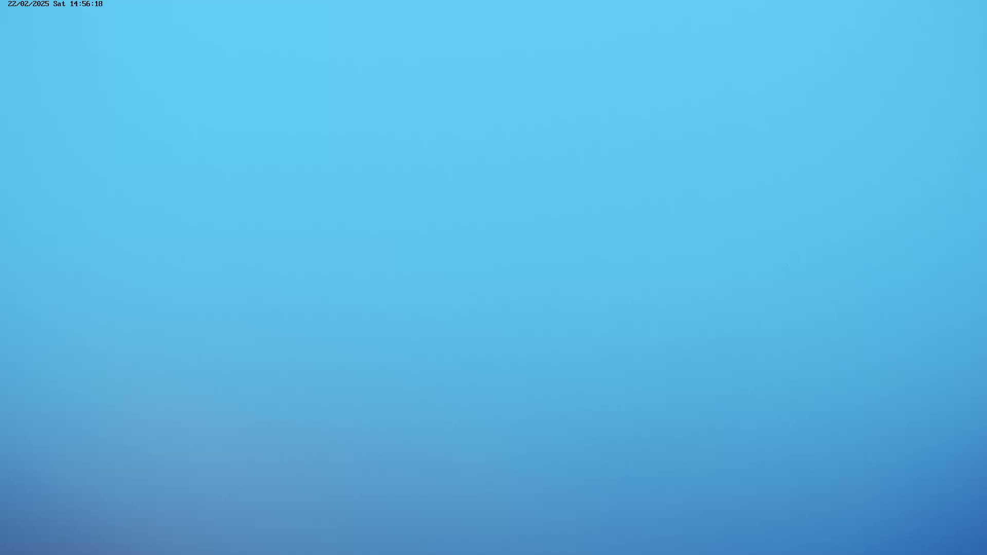 The image shows a clear, light blue sky.