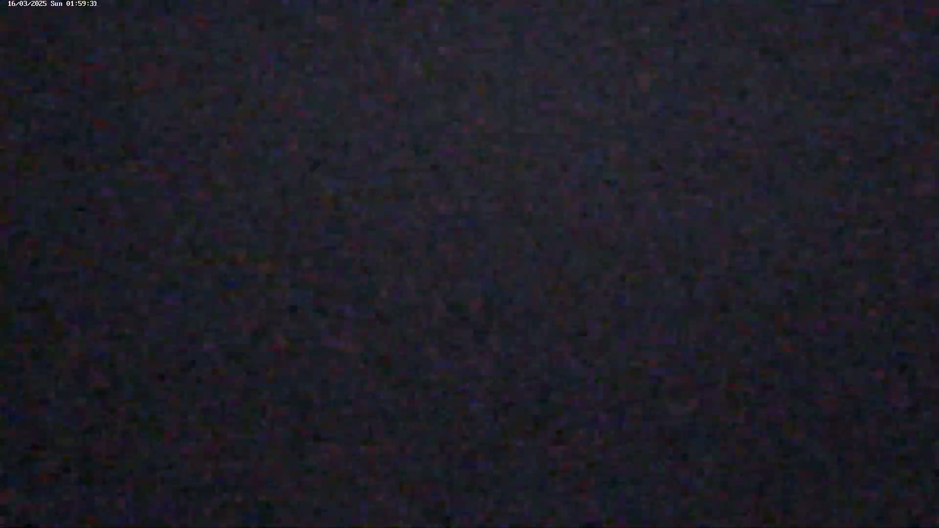 The image shows a dark, grainy, and indistinct view.