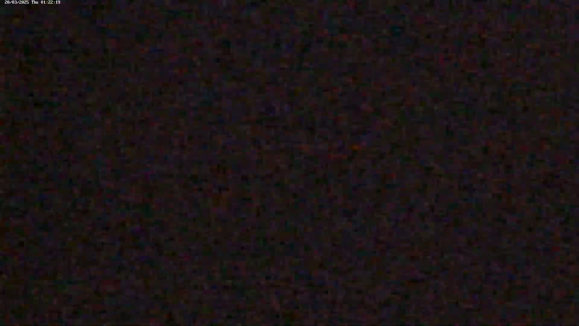 The image shows a dark, grainy, and indistinct view.