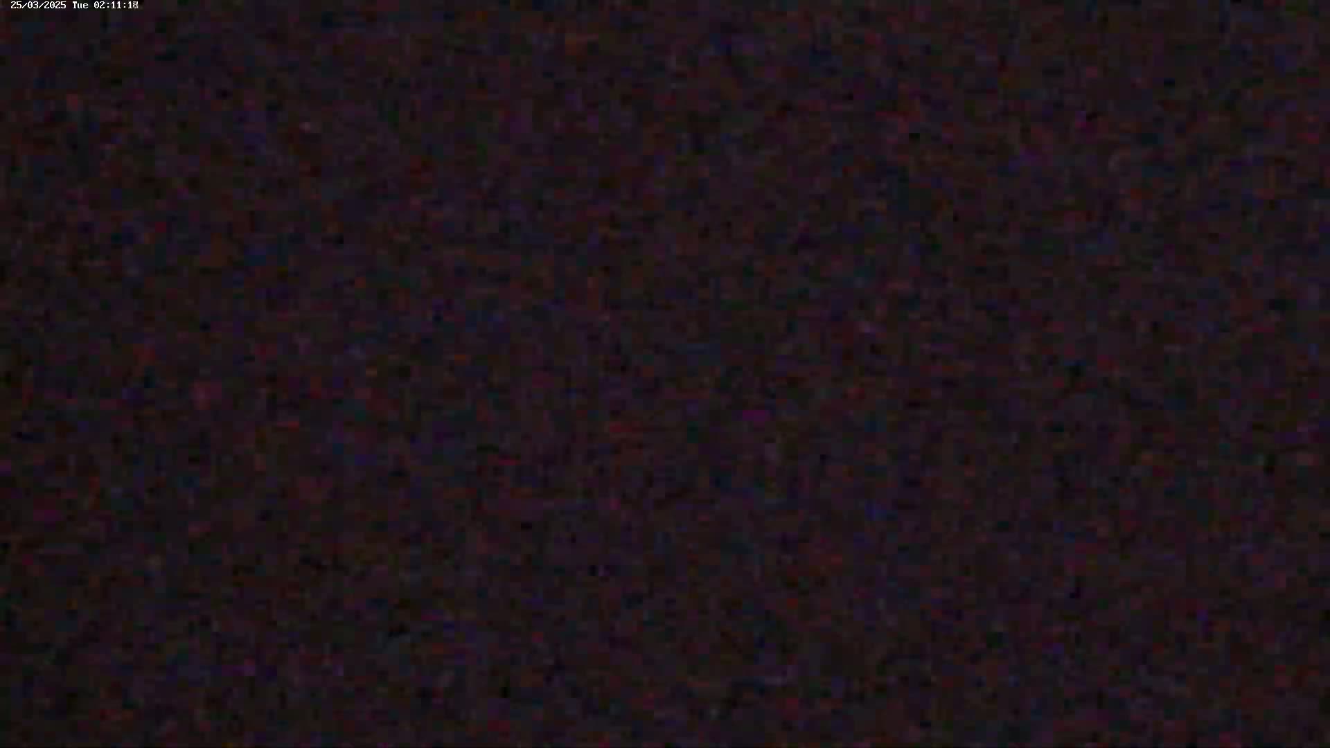 The image is a completely dark, grainy, and blurry screen.