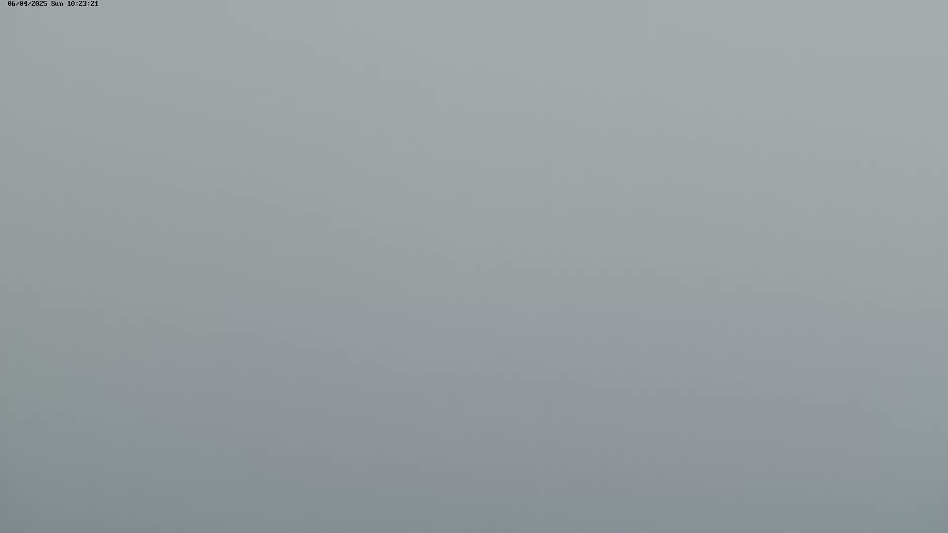 A very foggy or hazy scene is shown, with visibility severely limited.