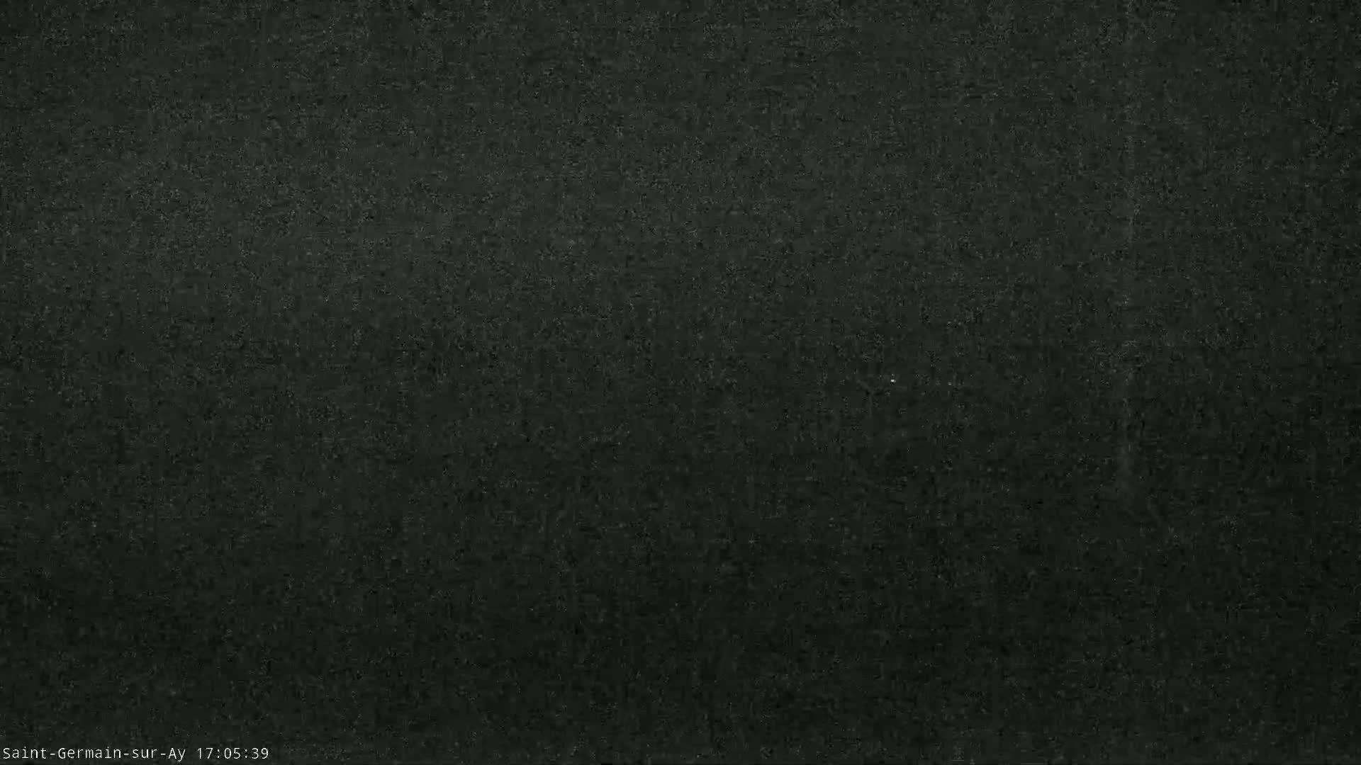 A dark gray, textured surface fills the entire image.