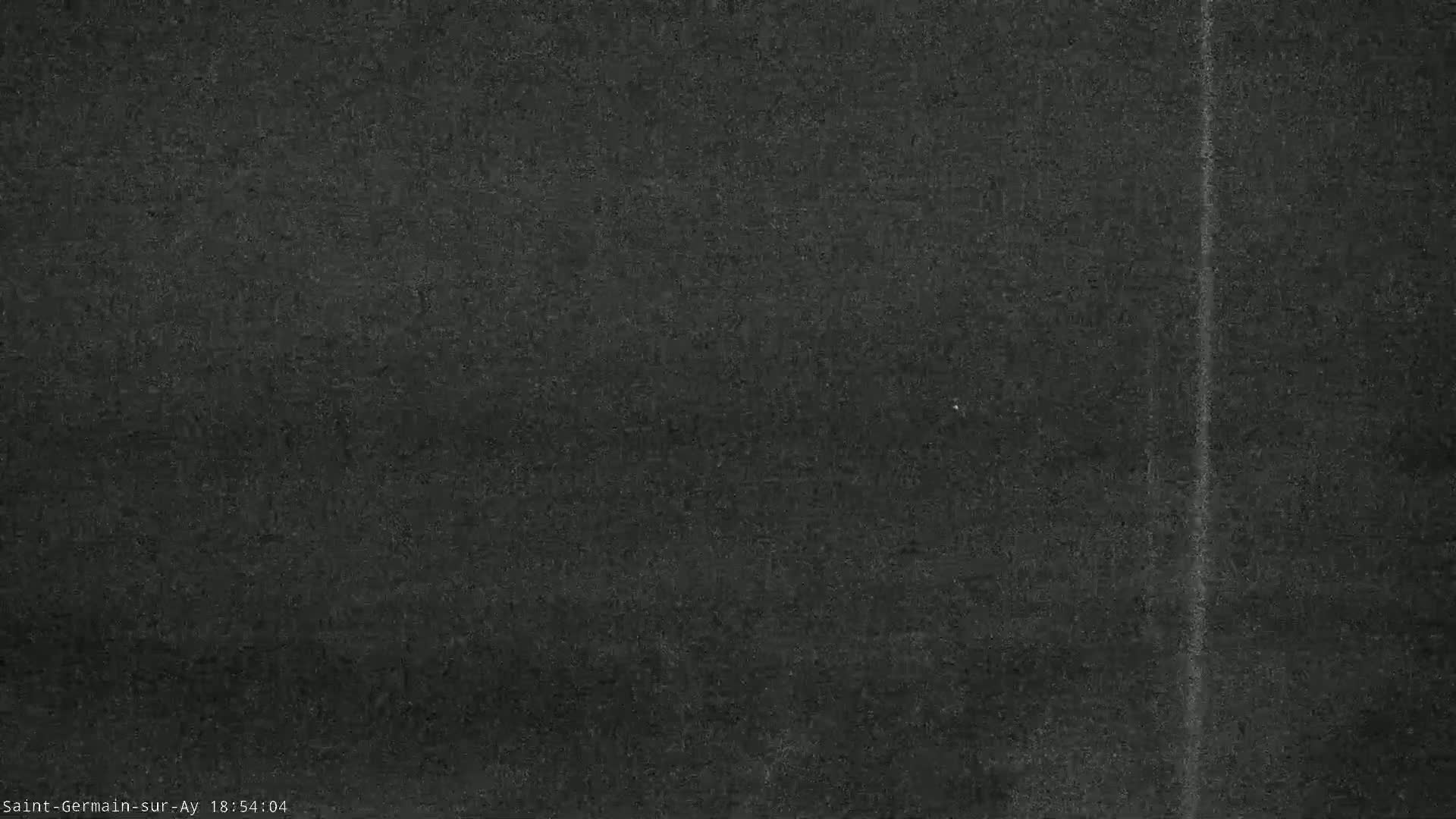 A dark gray textured surface shows a faint vertical line.