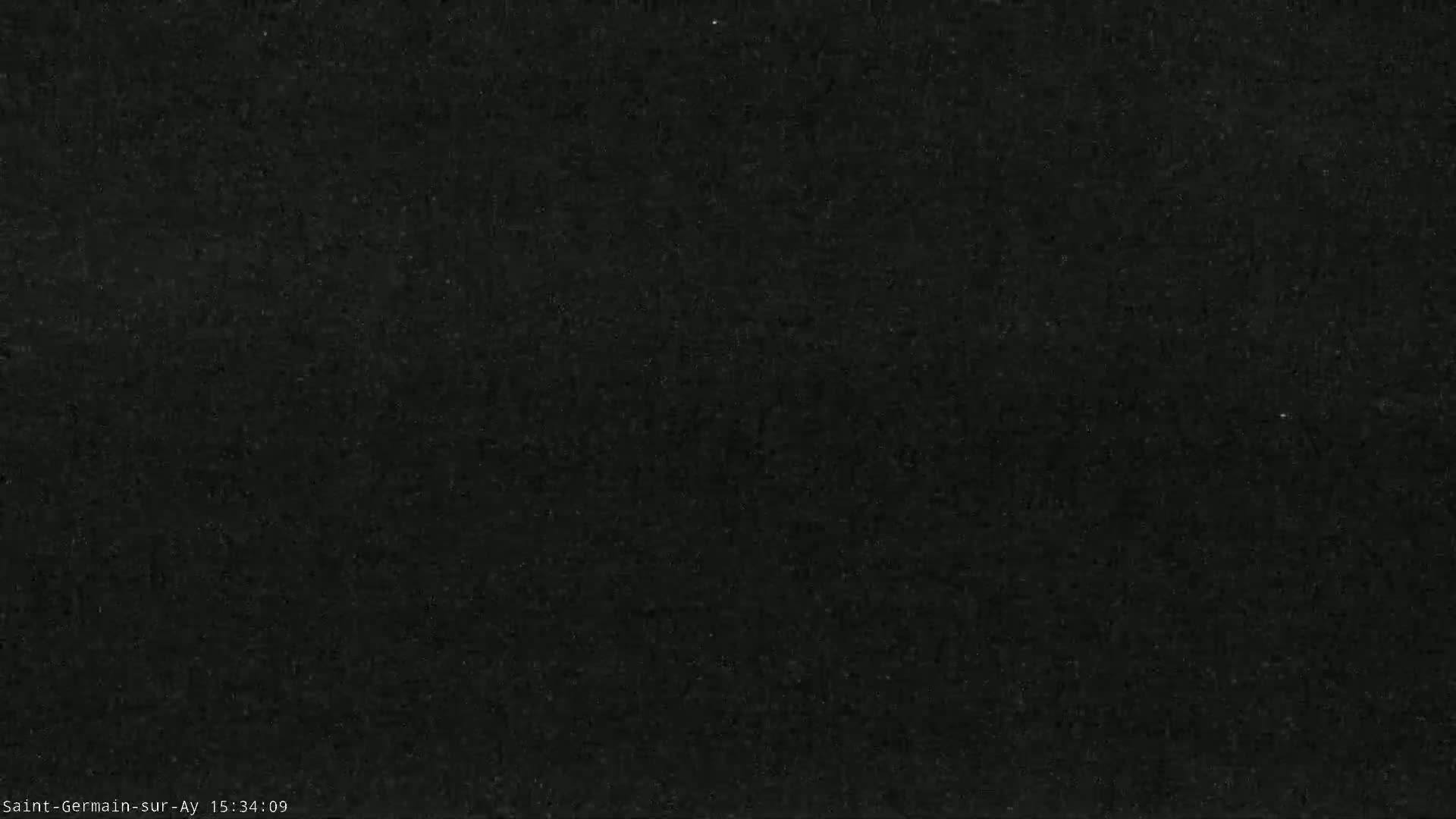 A dark gray or black textured surface fills the entire image.