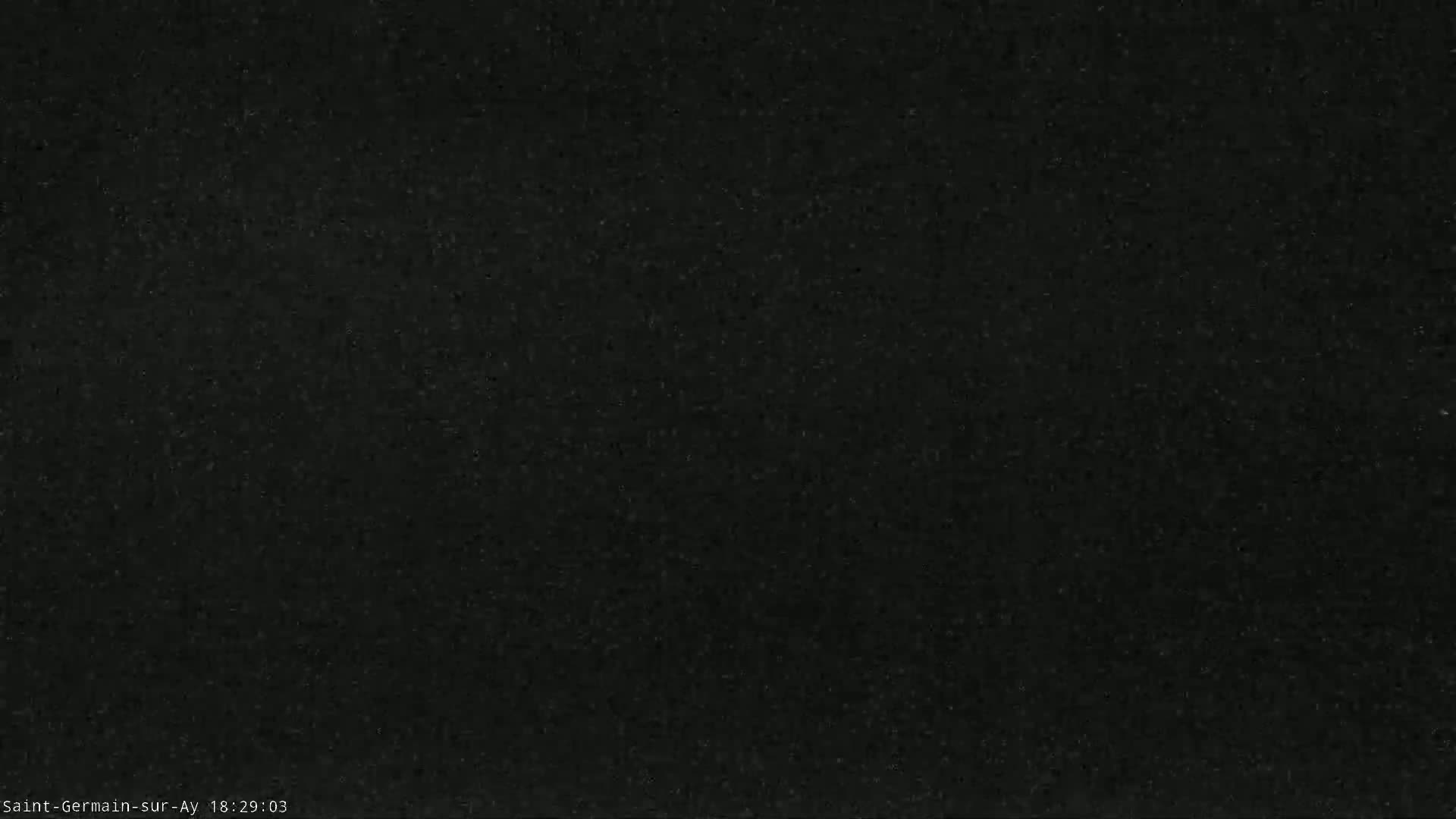 The image shows a dark gray or black textured surface.
