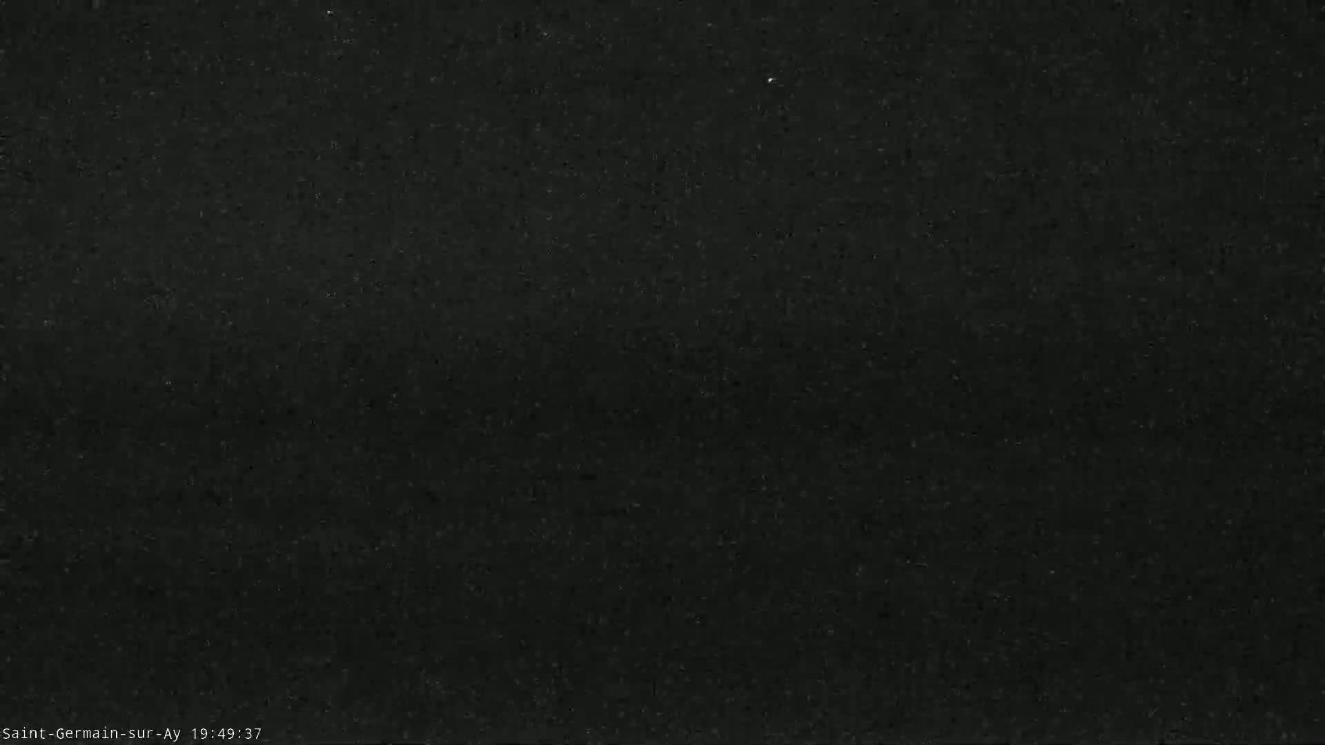 A dark, uniformly textured surface fills the image.
