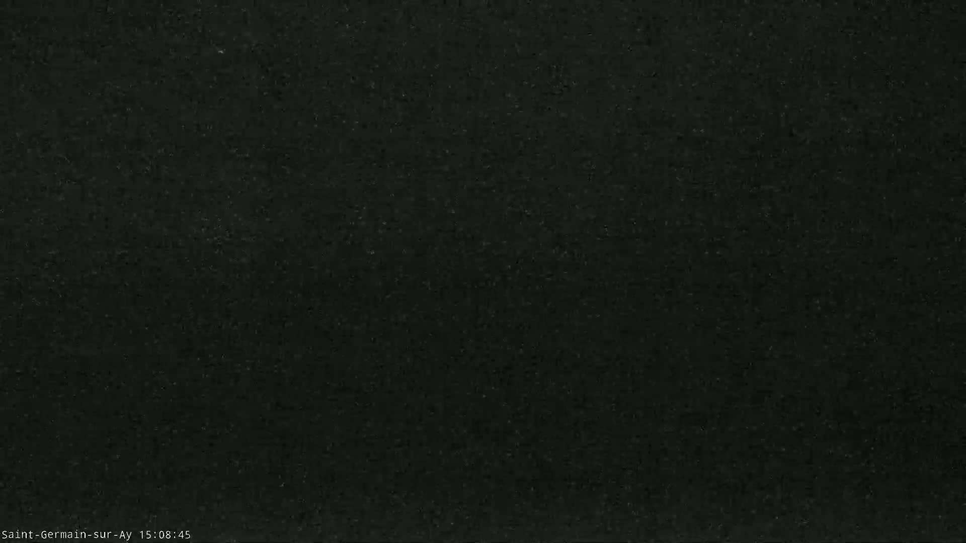 The image shows a dark gray or black textured surface.