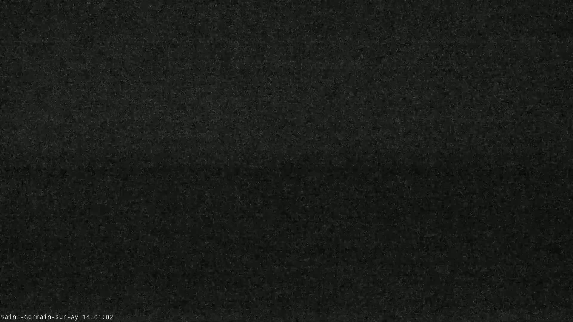 A dark, grainy image obscures any discernible features.