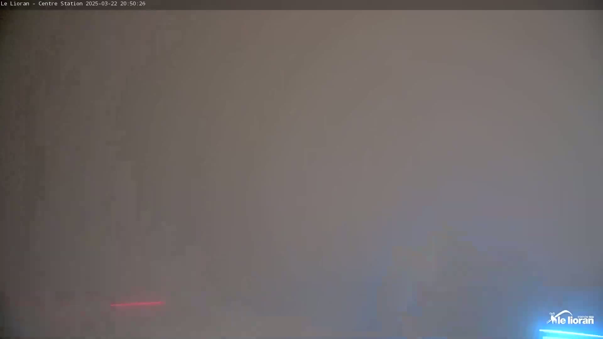 A hazy, gray scene is visible, possibly due to fog or mist.